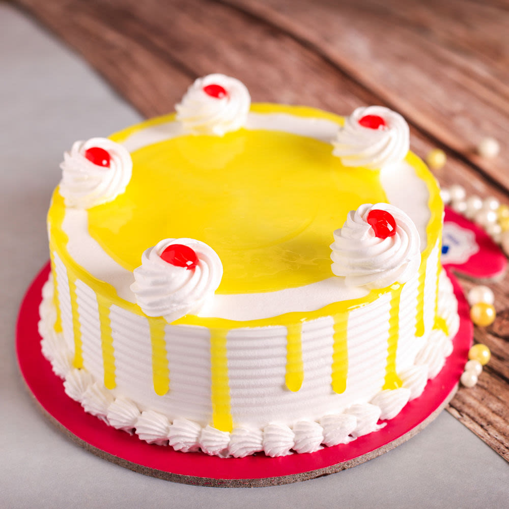 Order 1 Kg Eggless Fresh Cream Pineapple Cake Online at Best Prices in  India | Theobroma