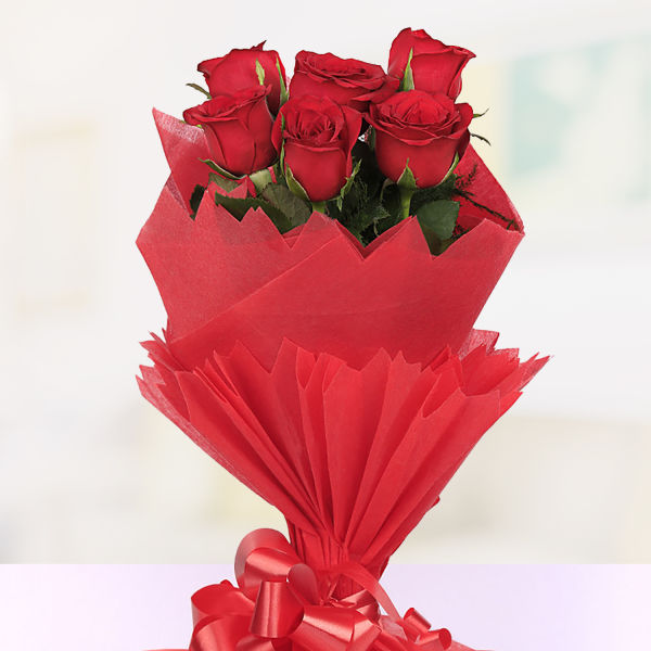 Buy 6 red roses in red paper packing