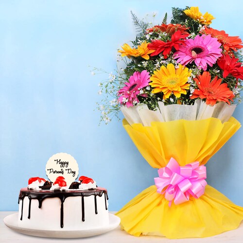 Buy Blooming Gerberas N Blackforest Cake