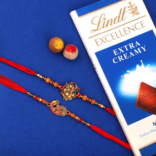 Buy Ganesha & Peacock Rakhis with Lindt Bar