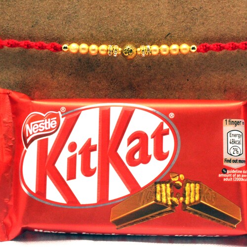 Buy Om Rakhi with Kitkat