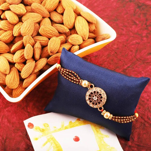 Buy Stone Studded Round Rakhi N Almond Combo