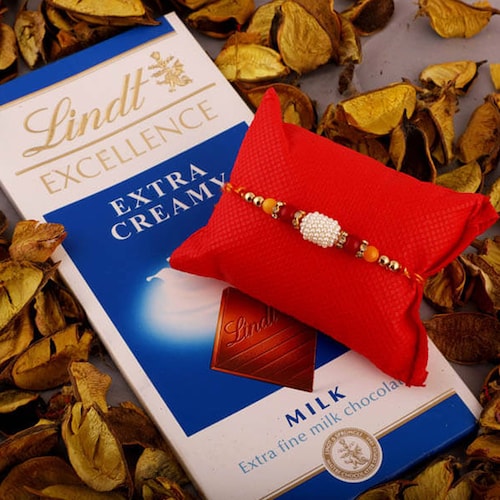 Buy White Bead Rakhi With Lindt Choco Bar