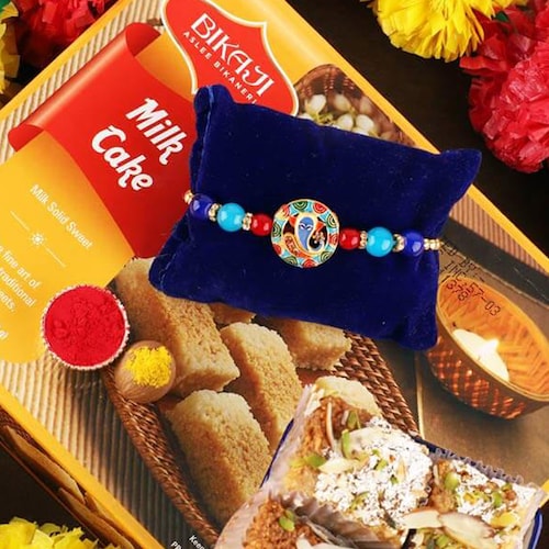 Buy Spiritual Ganesha Rakhi With Milk Cake Treat