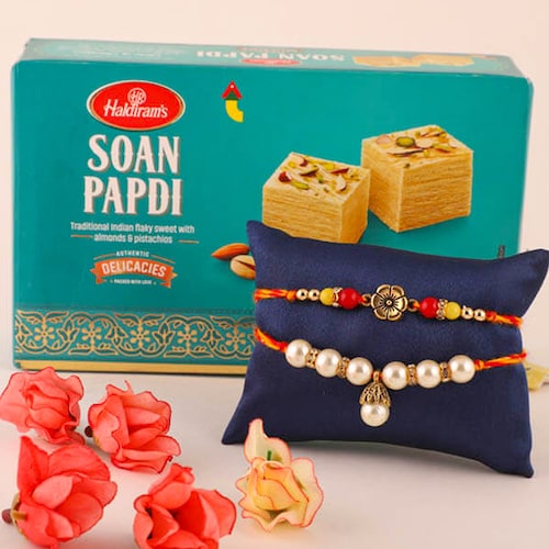 Buy Pearl Blessed Rakhis with Soan Papdi