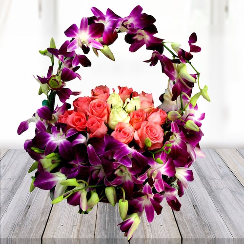 Buy Pink with Yellow roses with Orchids in a basket