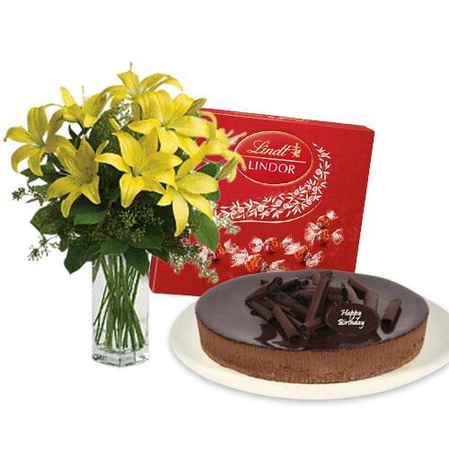 Buy Lilies Bouquet with chocolate cheesecake and Lindt Milk Chocolate Box