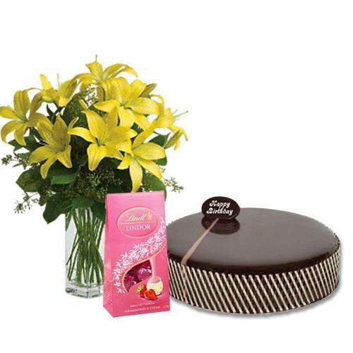 Buy Chocolate Mud Cake with Yellow Lilies and Lindt Strawberry Chocolates