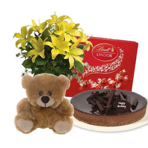 Buy Lilies Bouquet with chocolate cheesecake and Lindt Milk Chocolate Box and 6 inch Teddy