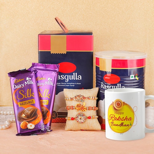 Buy Set of 3 Rakhis With Mug Cadbury Silk & Rasgulla Delight