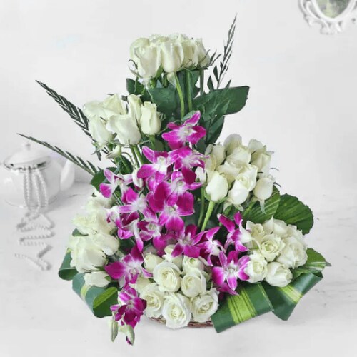 Buy White Roses And Orchids In Cane Basket