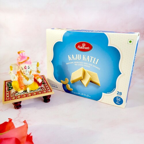 Buy Ganpati Viranjman Idol With Kaju Katli