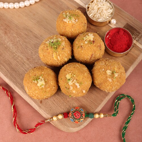 Buy Om Rakhi With Yummy Besan Ladoo  250 gm