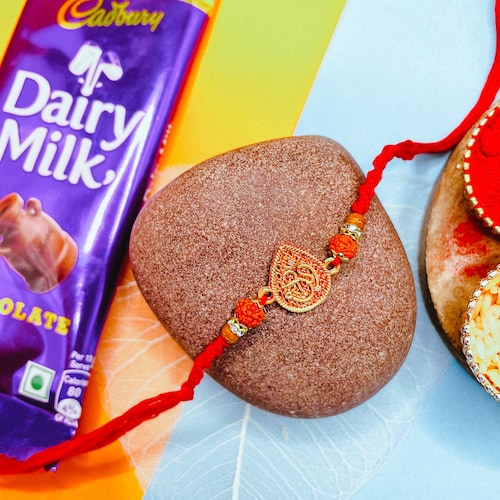 Buy Om Rudraksha Rakhi With Dairy Milk Chocolate Bar