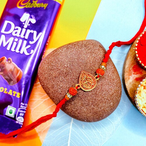 Buy Om Rakhi With Dairy Milk Chocolate Bar