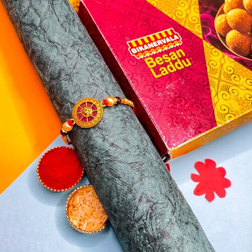 Buy Om Rakhi With Basan Ludoo