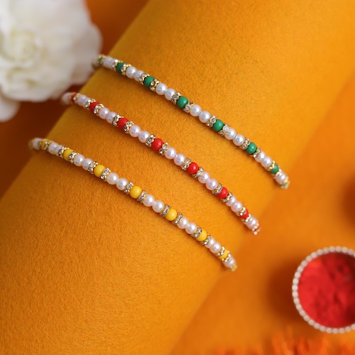 Buy Red Yellow And Green Pearl Stone Set Of 3 Rakhis