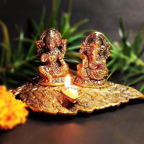 Buy Golden Laxmi Ganesh On Leaf With Diya