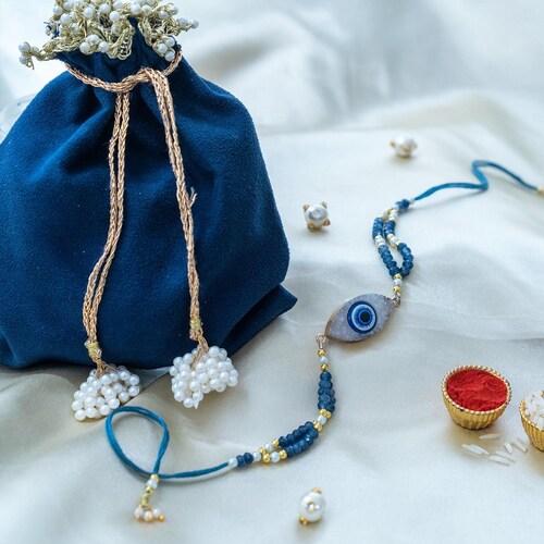 Buy Mystic Evileye Rakhi In Suede Potli