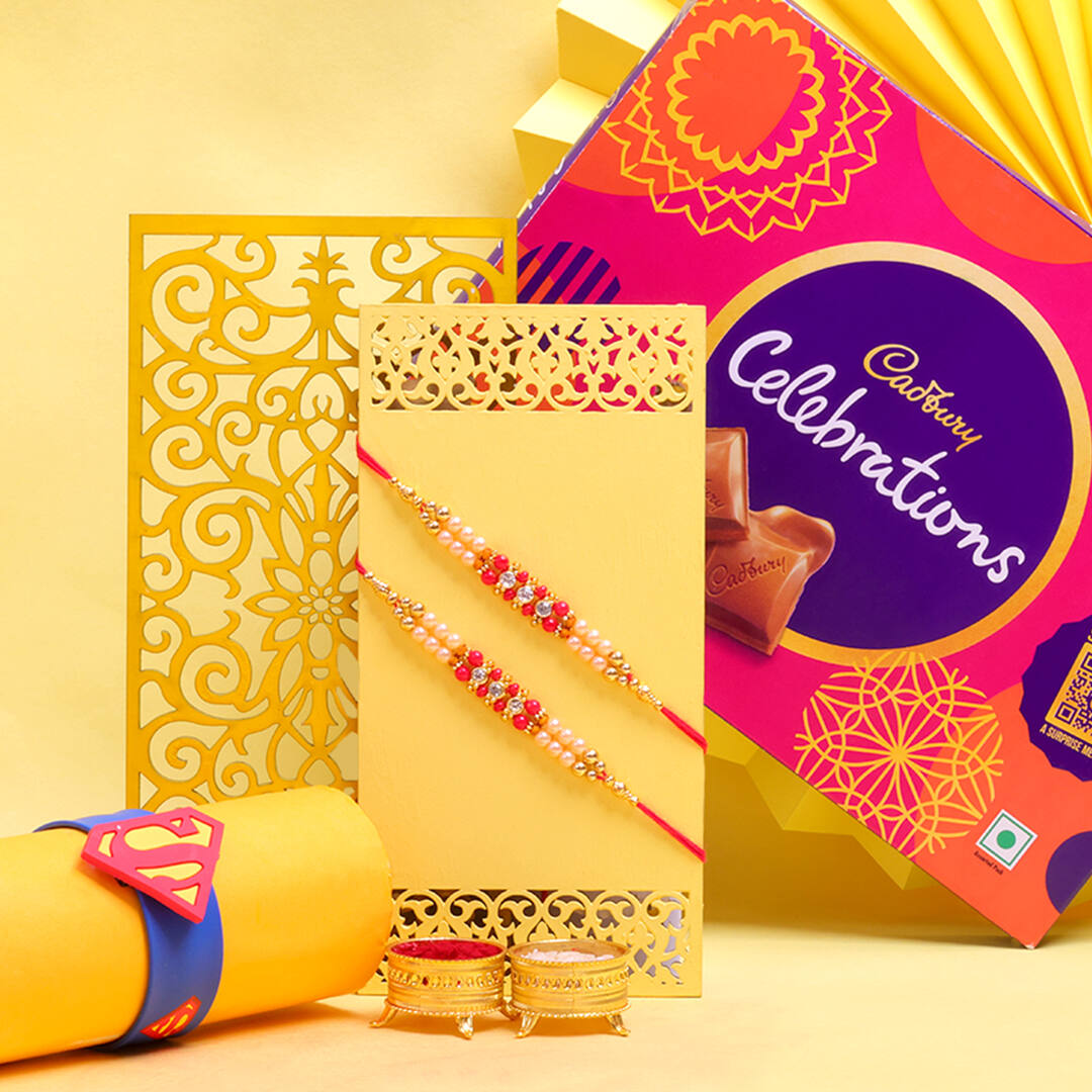 Rakhi Gifts-Ghasitaram Big Hamper box of 12 Goodies with 5 Rakhi –  Ghasitaram Gifts