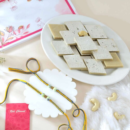 Buy Yummy Kaju Katli with 2 Rakhi