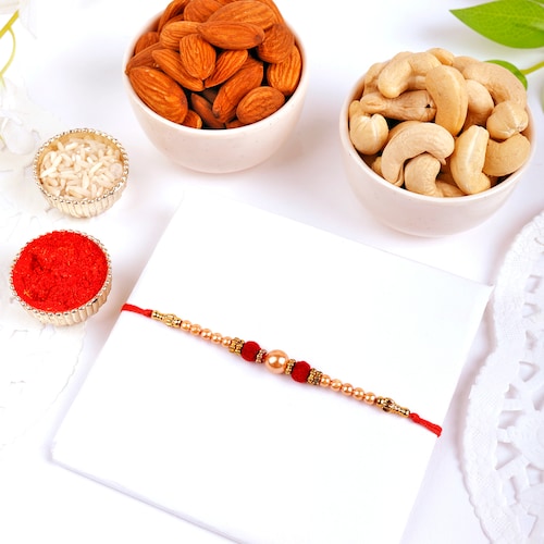 Buy Single Velvet Pearl Rakhi N Dry Fruit Combo