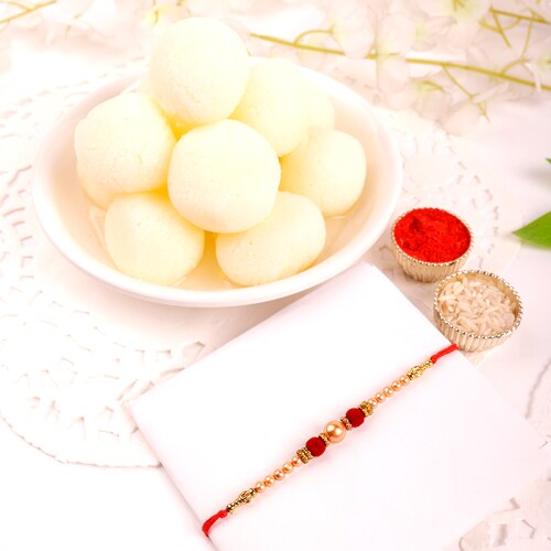 Buy Velvety Pearl Rakhi With Rasgulla Delights