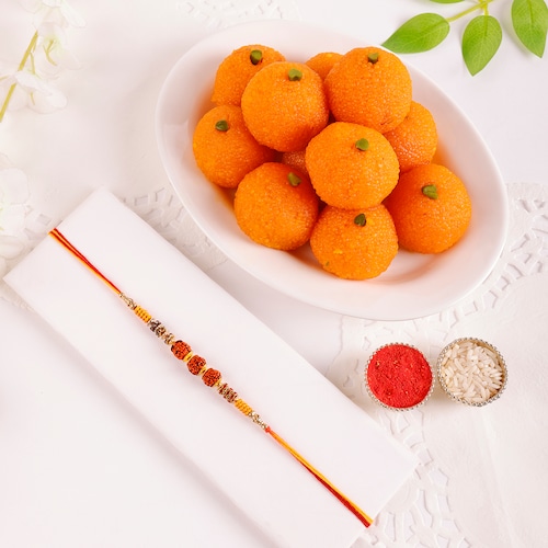 Buy Rudraksha Rakhi With Motichoor Laddoo 250 gm