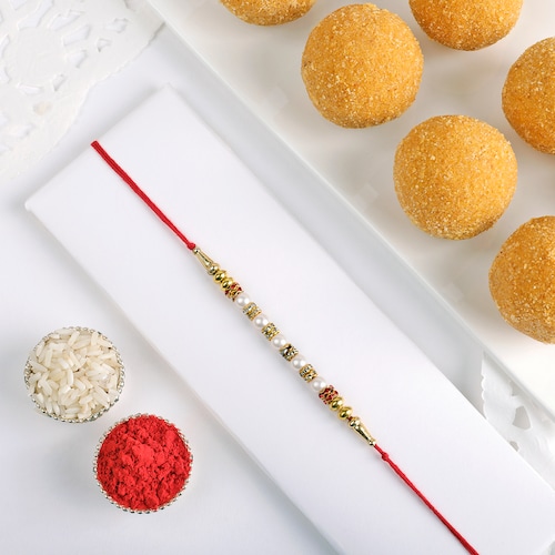 Buy Pearl Rakhi With Besan Ladoo 250 gm