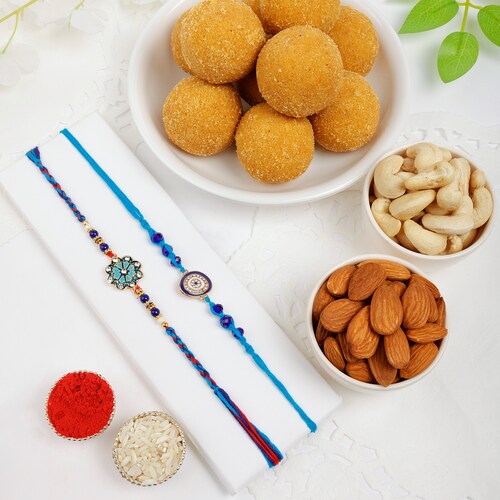 Buy Enchanting Rakhi Set with Laddoo and Nuts