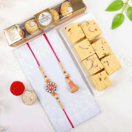 Buy Elegant Rakhi Duo with Sweet Treats