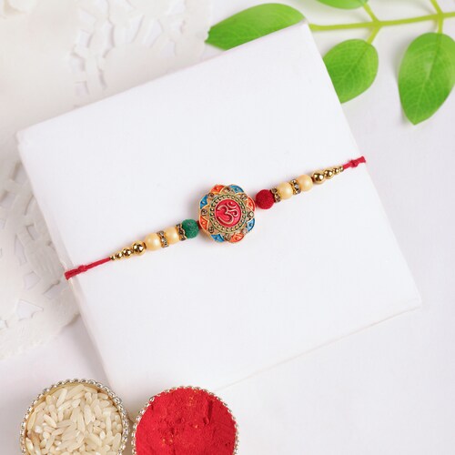 Buy Pious Om Sign Rakhi