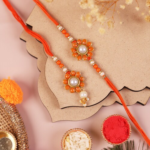 Buy Bhaiya Bhabhi Orange Rakhi Set