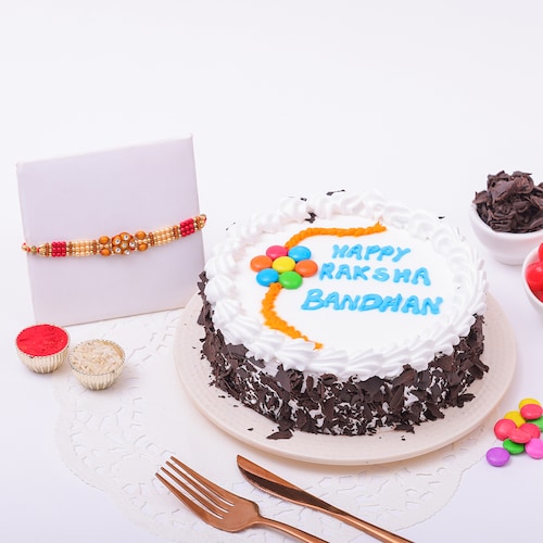 Buy Delightful Black Forest Cake and Beads Rakhi