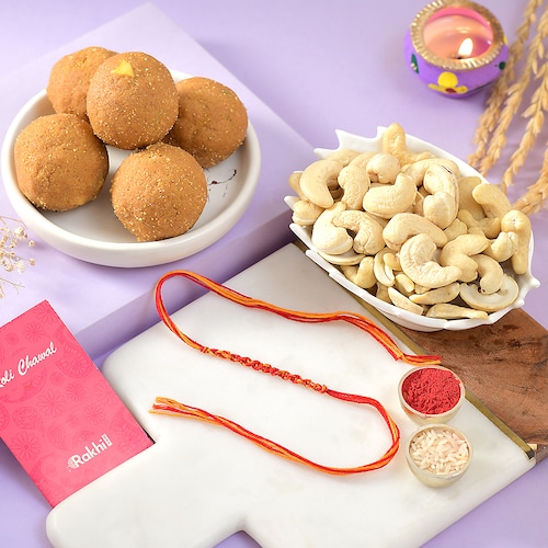 Buy Thread Rakhi with Besan Laddoo and Cashew