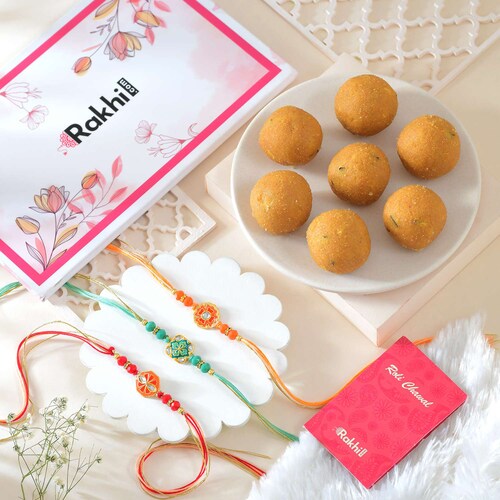 Buy Set of 3 Elegant Rakhi with Besan Laddoo