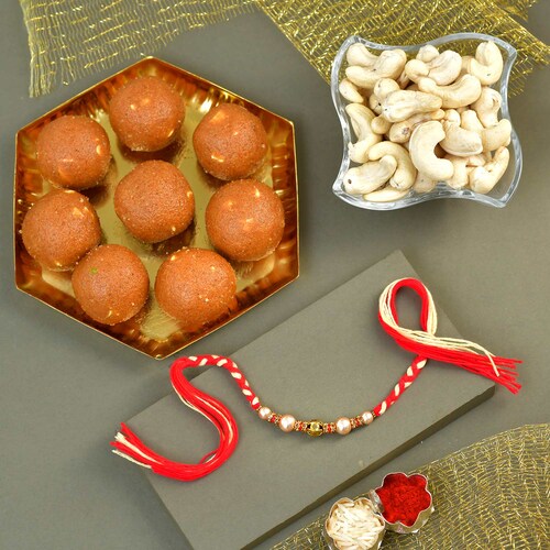 Buy White Pearl Rakhi with Dryfruit and Sweets