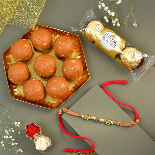 Buy Gold Pearl Rakhi with Dryfruit and Sweets