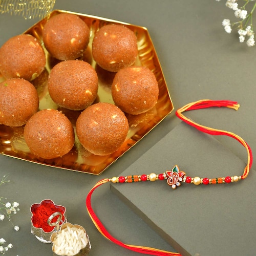 Buy Red Ganisha Pearl Rakhi with Sweets