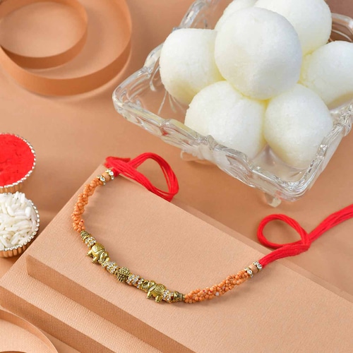 Buy Gold Pearl Rakhi with Rasgulla