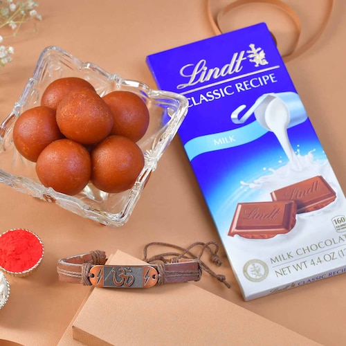 Buy OM RAKHI Band with Sweets and Chocolate