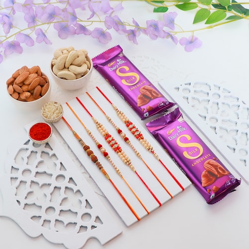 Buy Set of 5 Rakhi with Dairy Milk Silk Chocolate and Dry Fruits