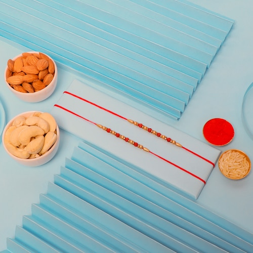 Buy Set of 2 Rudraksh Rakhis with Almond and Cashew