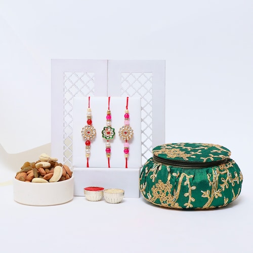 Buy Designer Rakhis with Dry Fruits in Silk Matki Potli